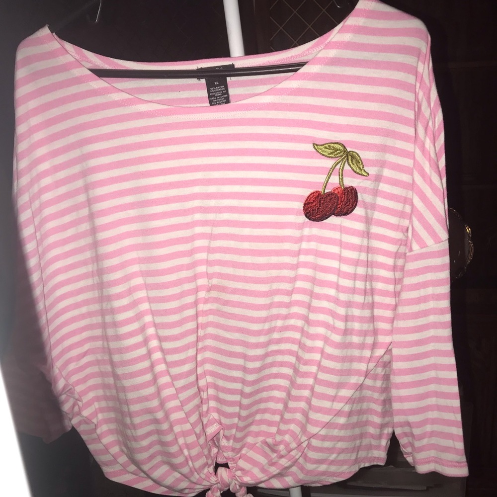 pink and white long sleeve shirt